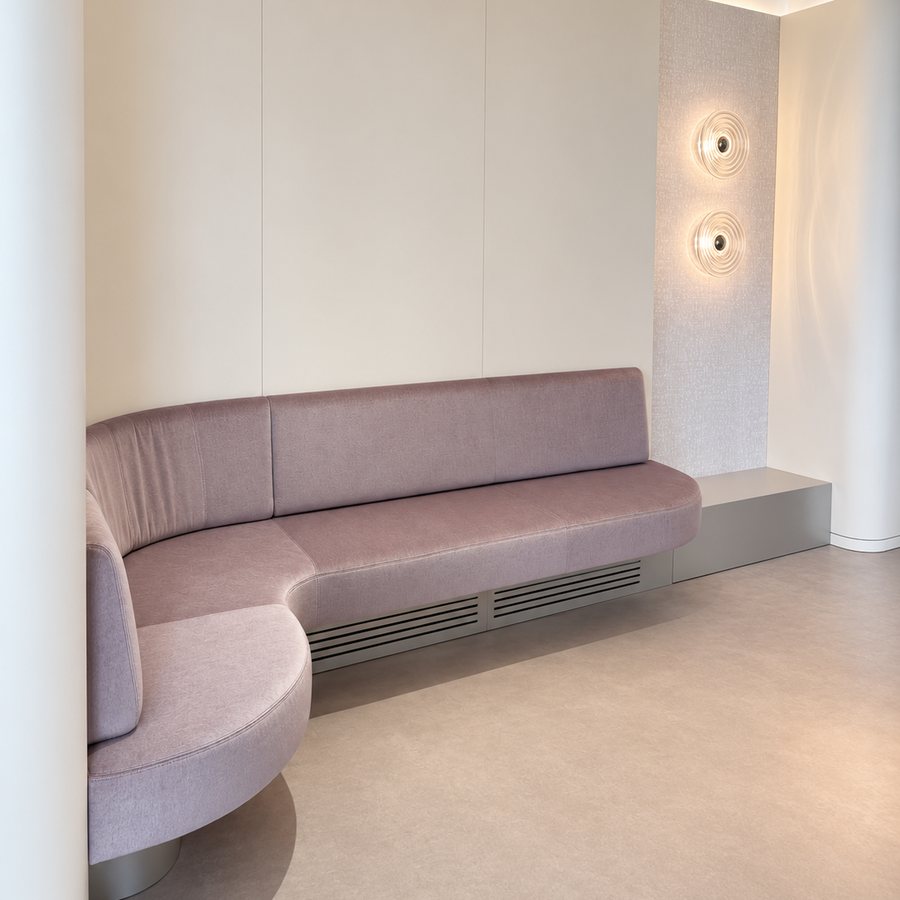 Waiting area with a dusty-rose bench